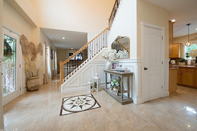 16 Kukas Rd, Monticello, NY 12701 - foyer entrance featuring a decorative wall, stairway, recessed lighting, and a wainscoted wall