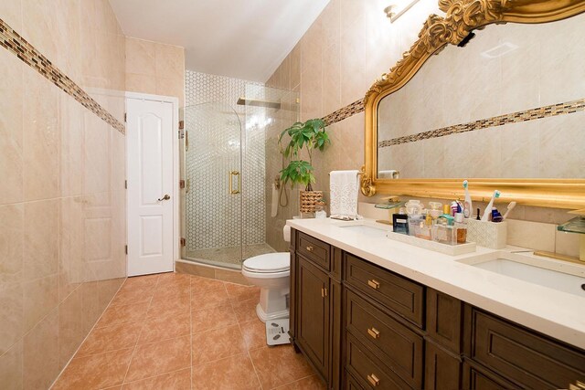 16 Kukas Rd, Monticello, NY 12701 - bathroom with tile patterned flooring, toilet, a stall shower, double vanity, and tile walls