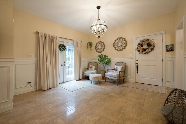 16 Kukas Rd, Monticello, NY 12701 - foyer entrance featuring a decorative wall, a chandelier, and a wainscoted wall