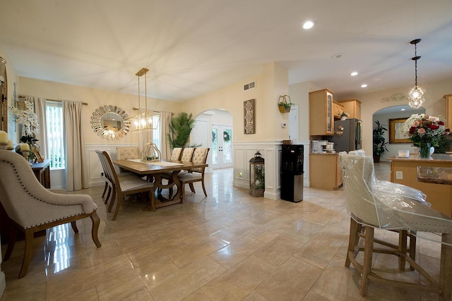 16 Kukas Rd, Monticello, NY 12701 - dining space with arched walkways, a decorative wall, wainscoting, recessed lighting, and a chandelier
