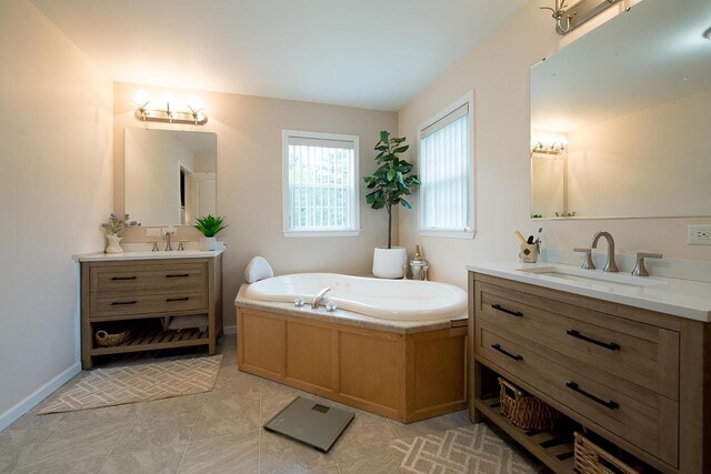 16 Kukas Rd, Monticello, NY 12701 - bathroom with two vanities, a garden tub, and baseboards