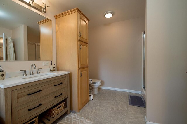 16 Kukas Rd, Monticello, NY 12701 - full bathroom with a stall shower, vanity, toilet, baseboards, and tile patterned flooring