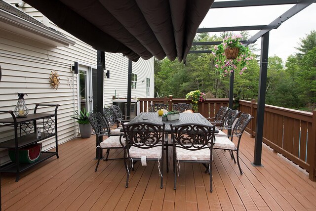 16 Kukas Rd, Monticello, NY 12701 - wooden deck with outdoor dining area and central air condition unit