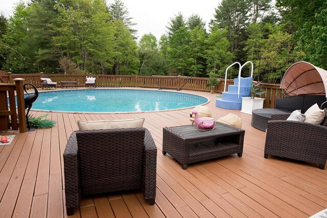 16 Kukas Rd, Monticello, NY 12701 - view of pool with an outdoor living space and a deck