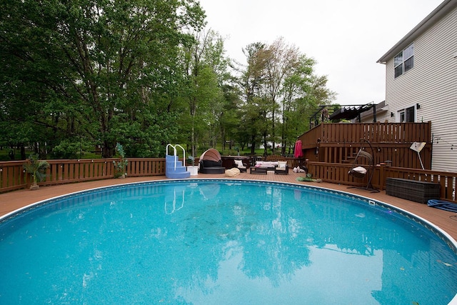 16 Kukas Rd, Monticello, NY 12701 - outdoor pool with a wooden deck and an outdoor hangout area