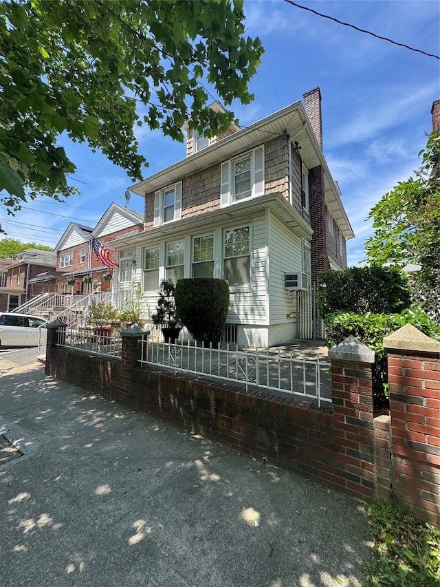 1039 Van Nest Ave, Bronx, NY 10461 - american foursquare style home featuring a chimney and a fenced front yard