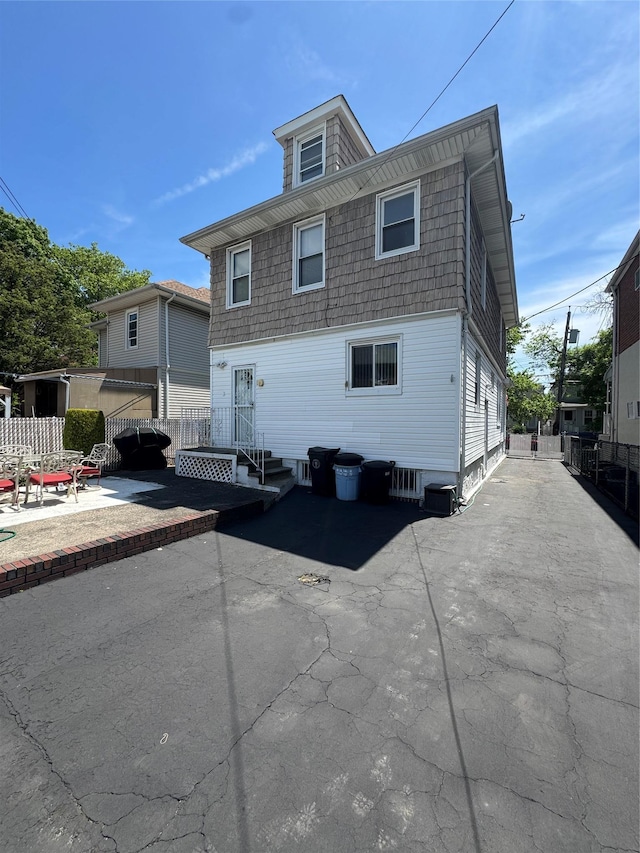 1039 Van Nest Ave, Bronx, NY 10461 - back of property featuring a patio and fence