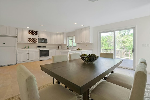 14 Cross Rd, Cortlandt Manor, NY 10567 - dining area with light tile patterned floors and recessed lighting