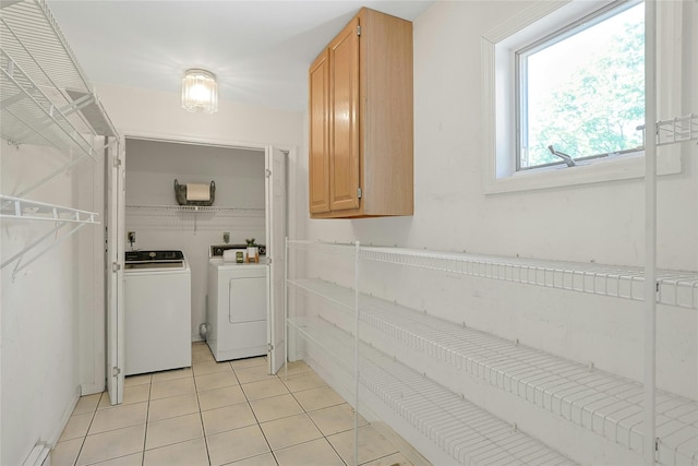 14 Cross Rd, Cortlandt Manor, NY 10567 - laundry room with washer and clothes dryer and light tile patterned floors