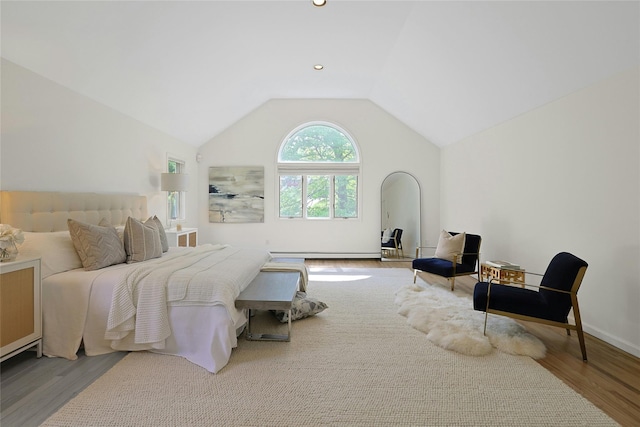 14 Cross Rd, Cortlandt Manor, NY 10567 - bedroom featuring wood finished floors, vaulted ceiling, a baseboard radiator, and baseboards