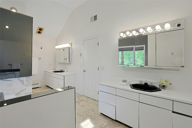 14 Cross Rd, Cortlandt Manor, NY 10567 - bathroom featuring a baseboard heating unit, vaulted ceiling, marble finish floors, and two vanities