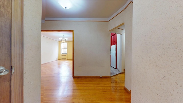 3250 Coney Island Ave Unit E15, Brooklyn, NY 11235 - hallway featuring crown molding, wood finished floors, and a chandelier
