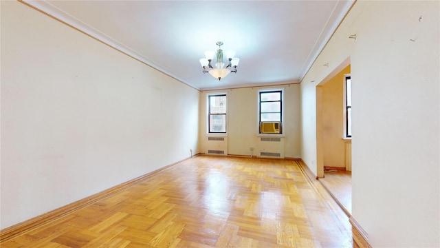 3250 Coney Island Ave Unit E15, Brooklyn, NY 11235 - spare room with a chandelier, crown molding, baseboards, and radiator heating unit