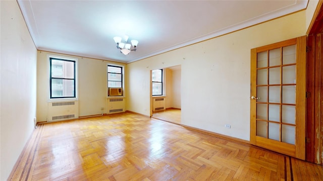 3250 Coney Island Ave Unit E15, Brooklyn, NY 11235 - unfurnished room featuring radiator heating unit, a chandelier, ornamental molding, and baseboards