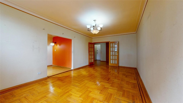 3250 Coney Island Ave Unit E15, Brooklyn, NY 11235 - spare room featuring baseboards, a chandelier, ornamental molding, and french doors