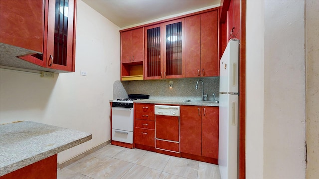 3250 Coney Island Ave Unit E15, Brooklyn, NY 11235 - kitchen with white appliances, a sink, decorative backsplash, light countertops, and glass insert cabinets