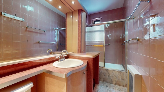 3250 Coney Island Ave Unit E15, Brooklyn, NY 11235 - bathroom featuring tiled shower / bath combo, vanity, tile walls, and recessed lighting