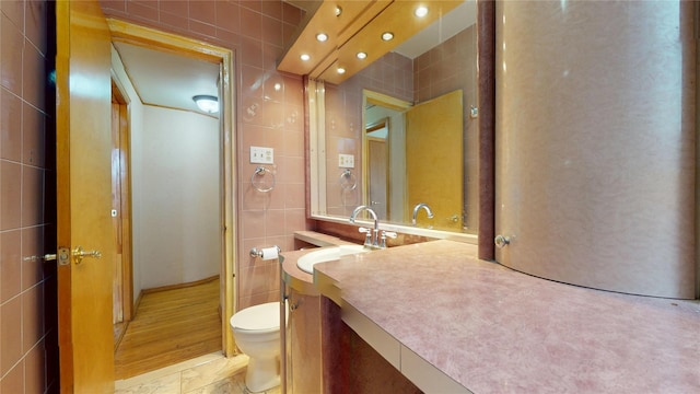 3250 Coney Island Ave Unit E15, Brooklyn, NY 11235 - bathroom with tile walls, toilet, and vanity
