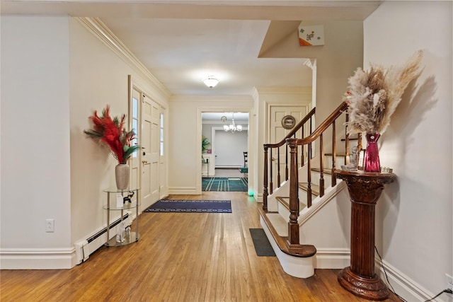 96 Warren St, Somers, NY 10589 - foyer with wood finished floors, stairs, a baseboard radiator, baseboards, and a chandelier
