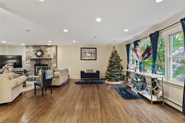 96 Warren St, Somers, NY 10589 - living area with wood finished floors, plenty of natural light, recessed lighting, a stone fireplace, and ornamental molding