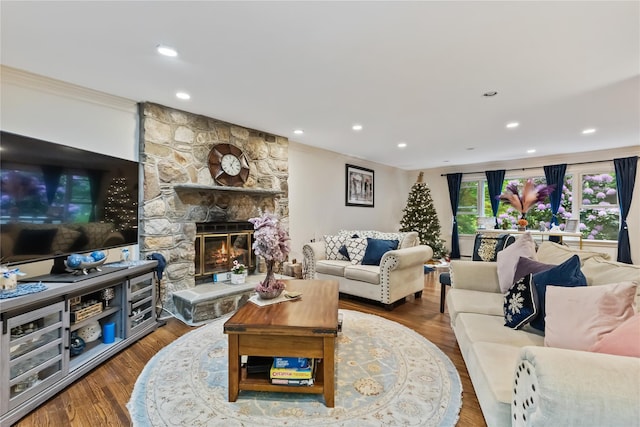 96 Warren St, Somers, NY 10589 - living room with crown molding, recessed lighting, a stone fireplace, and wood finished floors