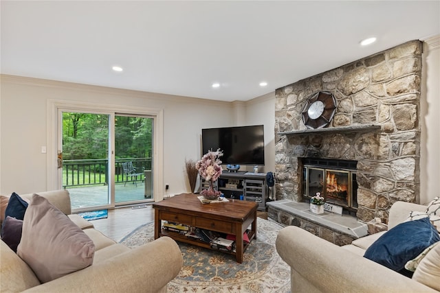 96 Warren St, Somers, NY 10589 - living area featuring crown molding, a stone fireplace, wood finished floors, and recessed lighting
