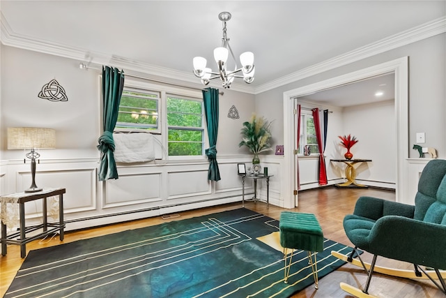 96 Warren St, Somers, NY 10589 - living area featuring a chandelier, a baseboard radiator, crown molding, a wainscoted wall, and wood finished floors