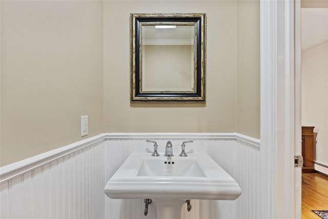 96 Warren St, Somers, NY 10589 - bathroom with a wainscoted wall, wood finished floors, and ornamental molding