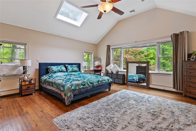 96 Warren St, Somers, NY 10589 - bedroom with lofted ceiling, a baseboard heating unit, wood finished floors, a baseboard radiator, and a ceiling fan