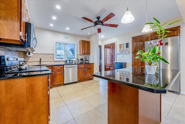 34 Marksman Ln, Levittown, NY 11756 - kitchen with stainless steel appliances, a sink, backsplash, ceiling fan, and light tile patterned floors