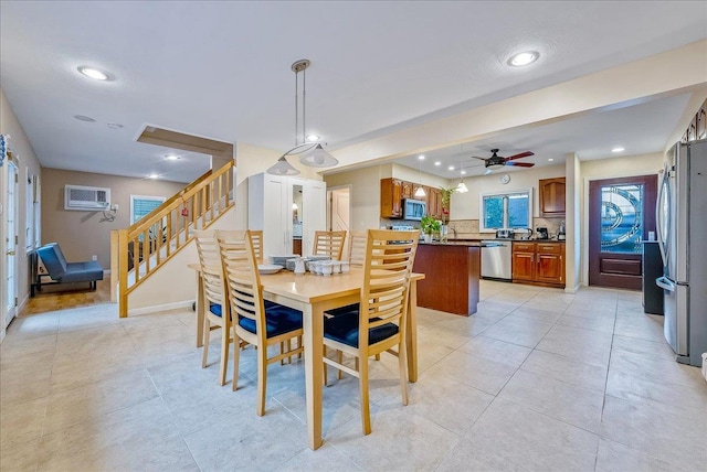 34 Marksman Ln, Levittown, NY 11756 - dining area with recessed lighting, light tile patterned floors, a ceiling fan, stairs, and baseboards