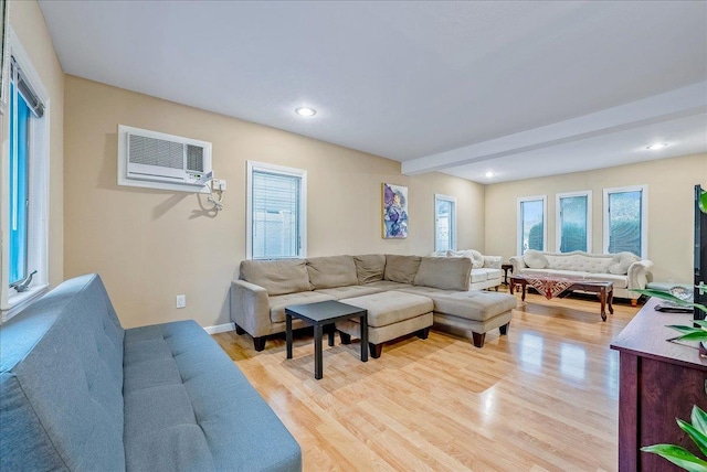 34 Marksman Ln, Levittown, NY 11756 - living area with a wall mounted AC, light wood-style flooring, beam ceiling, and recessed lighting