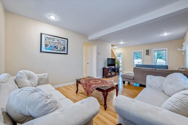 34 Marksman Ln, Levittown, NY 11756 - living area with light wood finished floors, baseboards, recessed lighting, and beam ceiling