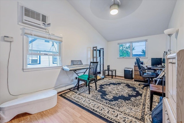 34 Marksman Ln, Levittown, NY 11756 - home office featuring lofted ceiling, a wall unit AC, wood finished floors, plenty of natural light, and ceiling fan