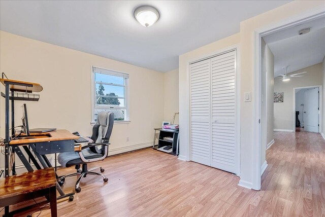 34 Marksman Ln, Levittown, NY 11756 - office area featuring light wood-type flooring, baseboards, and a baseboard radiator