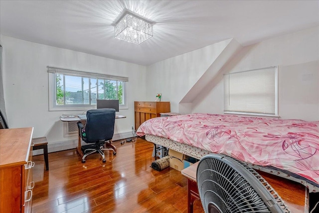 34 Marksman Ln, Levittown, NY 11756 - bedroom with wood finished floors and an office area