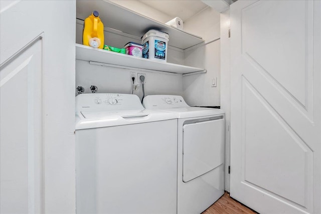 34 Marksman Ln, Levittown, NY 11756 - laundry area with separate washer and dryer and light wood-style floors