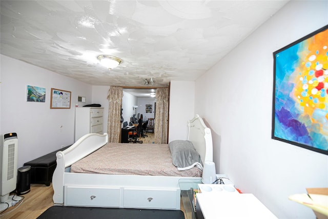 10124 78th St, Ozone Park, NY 11416 - bedroom featuring light wood-style floors and an office area
