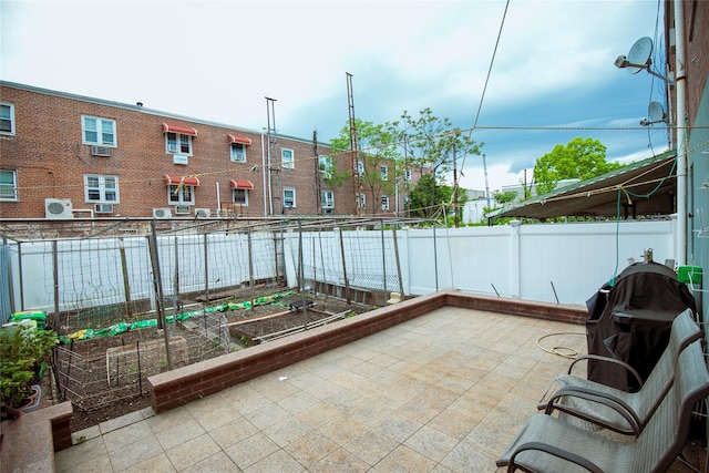 10124 78th St, Ozone Park, NY 11416 - view of patio / terrace with fence and a garden