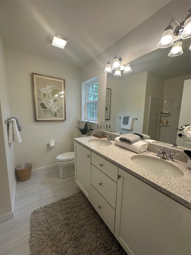 39 Hackensack Heights Rd, Wappingers Falls, NY 12590 - bathroom featuring toilet, a chandelier, baseboards, and double vanity