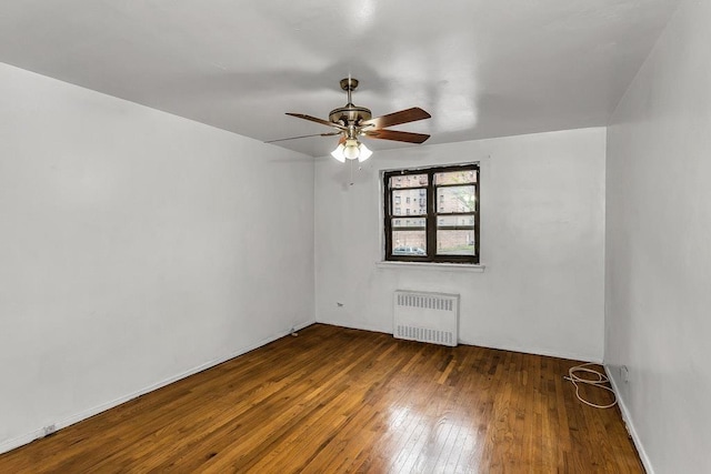 87-40 Francis Lewis Blvd Unit B38, Queens Village, NY 11427 - unfurnished room featuring radiator heating unit, ceiling fan, and hardwood / wood-style flooring