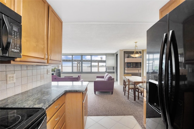 kitchen featuring black appliances, light carpet, tasteful backsplash, light tile patterned floors, and dark stone countertops