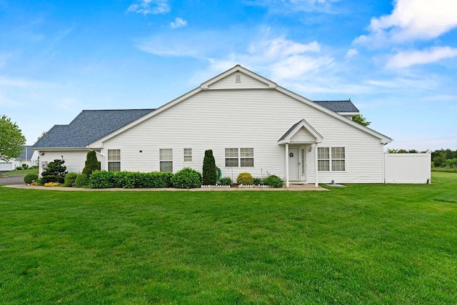 43 Summerfield Ln N Unit 43, Aquebogue, NY 11901 - view of front of house with a front yard and a shingled roof