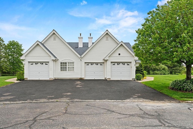 43 Summerfield Ln N Unit 43, Aquebogue, NY 11901 - traditional home with driveway, a chimney, and a front lawn