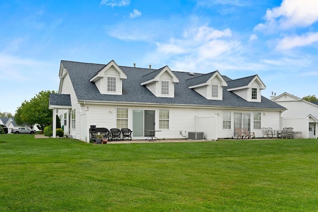 43 Summerfield Ln N Unit 43, Aquebogue, NY 11901 - back of property with a yard, roof with shingles, a patio area, and cooling unit