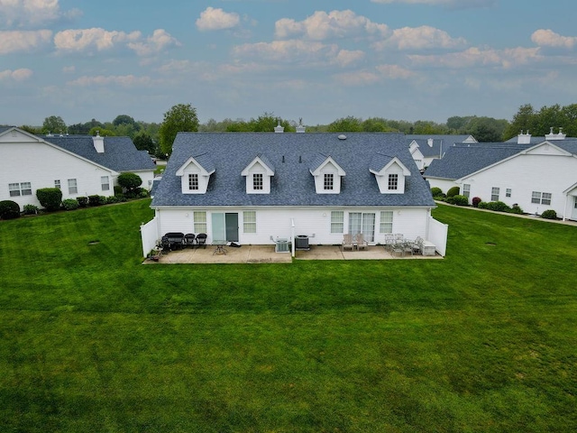 43 Summerfield Ln N Unit 43, Aquebogue, NY 11901 - back of house with a patio, a lawn, and a residential view