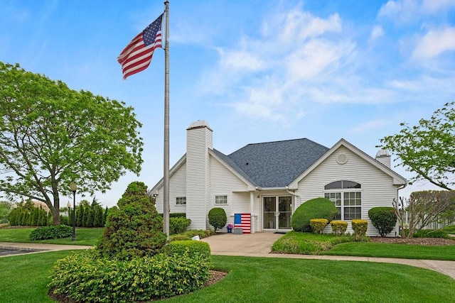 43 Summerfield Ln N Unit 43, Aquebogue, NY 11901 - view of front of property with a chimney and a front lawn