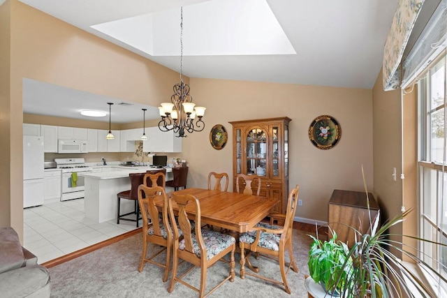 43 Summerfield Ln N Unit 43, Aquebogue, NY 11901 - dining room with vaulted ceiling, a chandelier, and a skylight