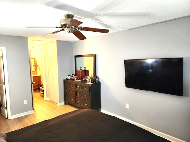 300 High Point Dr Unit 514, Hartsdale, NY 10530 - bedroom with light wood finished floors, baseboards, and ceiling fan