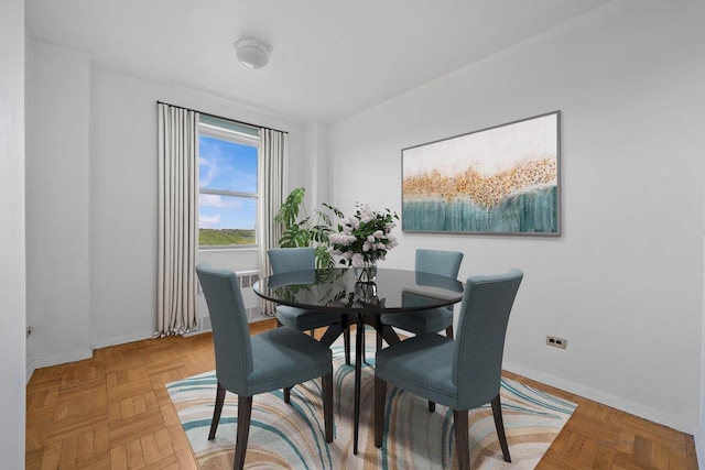 dining space featuring baseboards